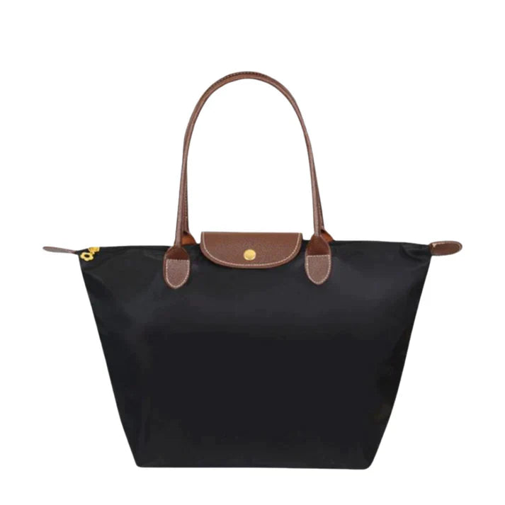 Sac à main noir élégant avec poignées en cuir marron, design classique et minimaliste, idéal pour un usage quotidien ou professionnel.