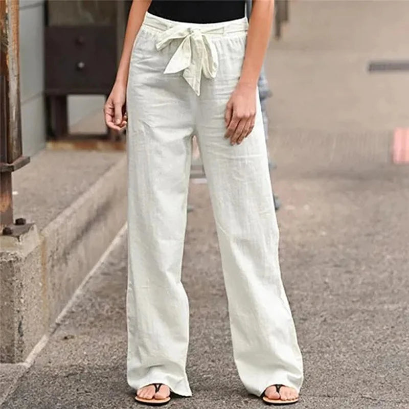 Pantalon large en lin blanc pour femme avec ceinture nouée, style décontracté, idéal pour l'été, mode féminine tendance, confort et élégance.