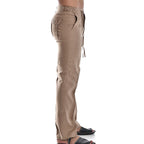 Pantalon beige en lin pour femme, coupe droite, taille élastique, poches latérales, style décontracté, idéal pour l'été et les tenues décontractées.