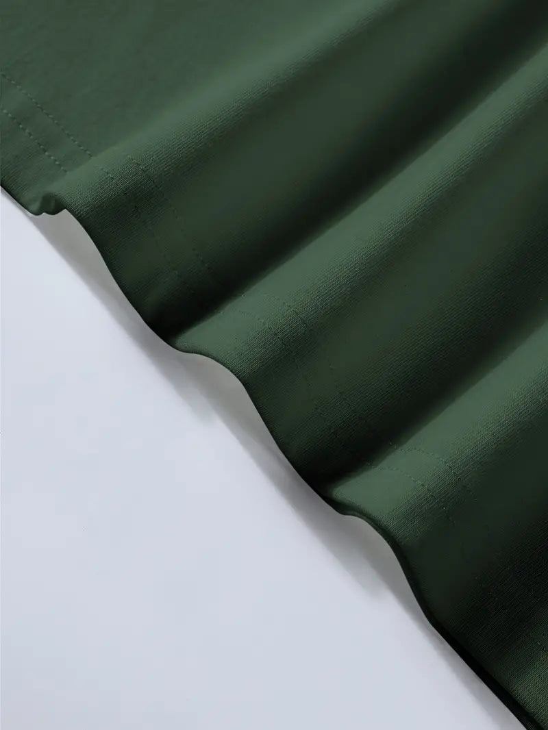 Tissu vert foncé en gros plan, texture douce et ondulée, idéal pour la couture et la décoration intérieure. Textile de haute qualité.