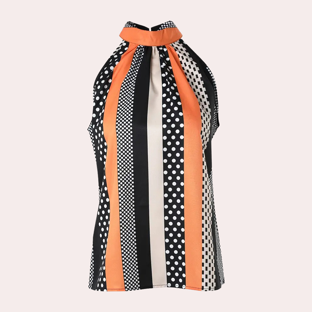 Haut sans manches à col montant, motif rayé et à pois noir, blanc et orange. Mode femme, style rétro chic, tendance printemps-été.