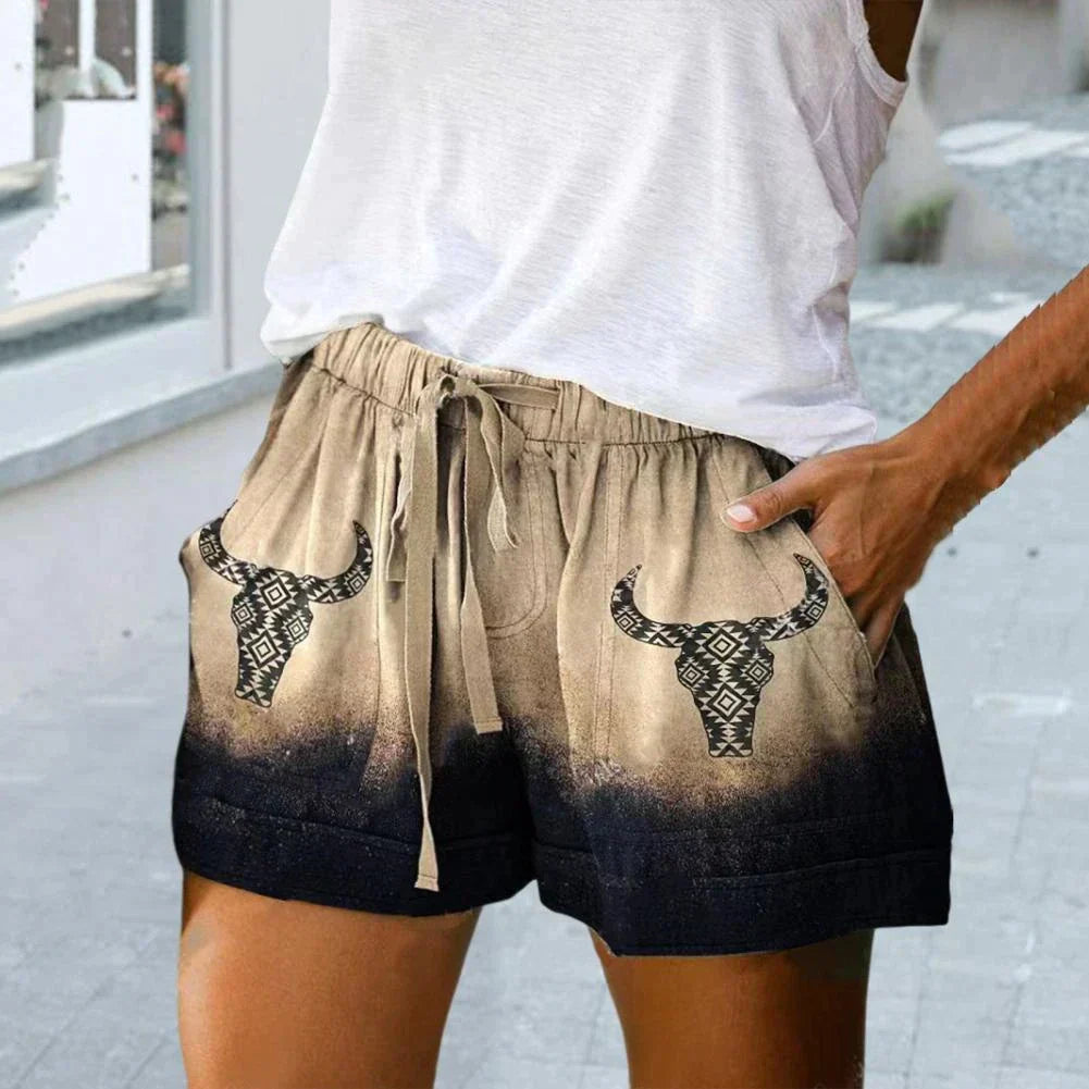 Short en lin beige et noir avec motifs de taureau, poches avant, ceinture à cordon. Mode estivale décontractée pour femmes.