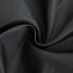 Tissu noir en coton, texture douce et lisse, idéal pour couture et mode. Matériau de haute qualité, parfait pour vêtements et décoration.