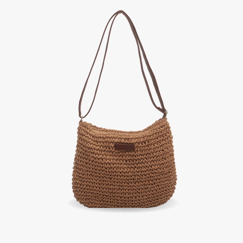 Sac à main en paille tressée marron avec bandoulière, style bohème chic, idéal pour l'été et les sorties décontractées. Accessoire mode tendance.