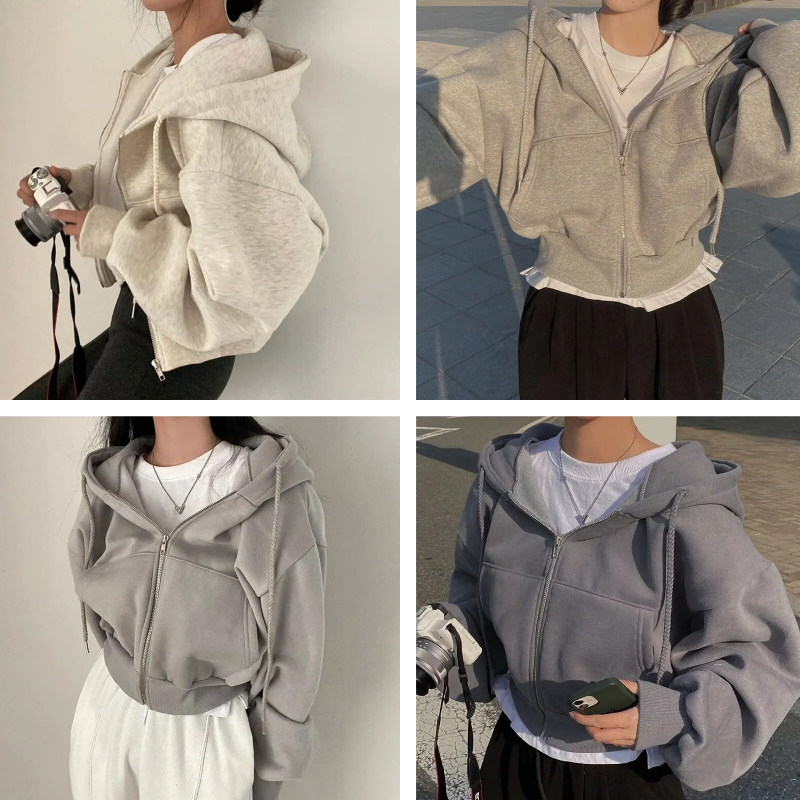Quatre femmes portant des sweats à capuche zippés dans des tons neutres, posant en extérieur. Mode décontractée, tendance automne, style urbain.