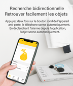 Smartphone affichant une application de recherche d'objets, avec un appareil anti-perte noir sur une table. Technologie de localisation d'objets.