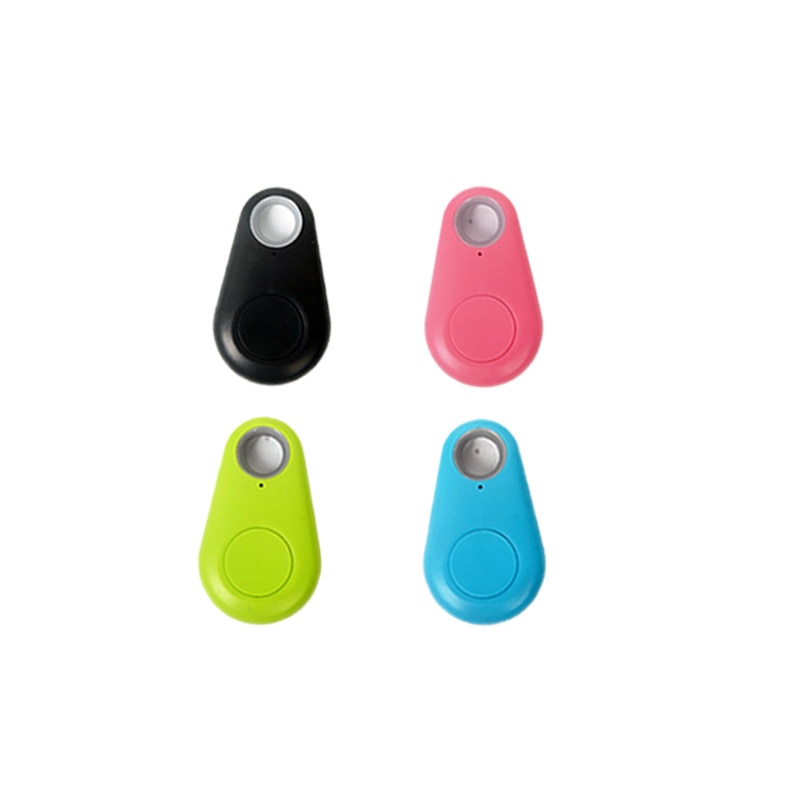 Quatre porte-clés traqueurs Bluetooth colorés (noir, rose, vert, bleu) pour localisation d'objets perdus. Accessoires connectés pratiques.