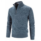Pull bleu chiné pour homme avec col zippé, manches longues, en laine douce. Mode automne-hiver, style décontracté et élégant.