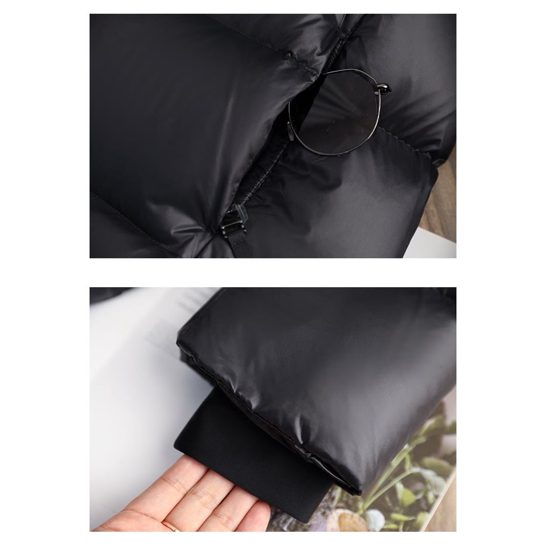 Doudoune noire en tissu matelassé, avec lunettes rondes posées dessus. Manchette élastique visible. Mode hiver, vêtement chaud et élégant.