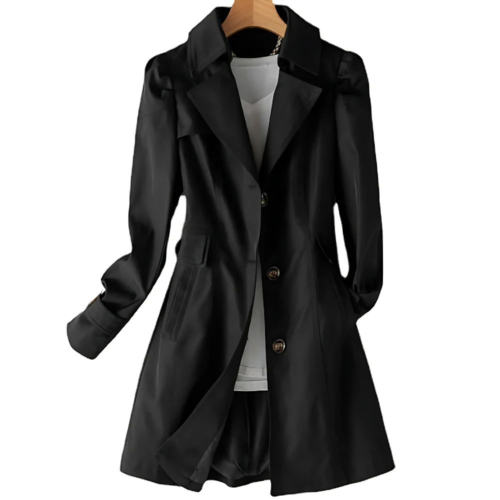 Manteau noir élégant pour femme sur cintre, avec col à revers et boutons, idéal pour l'automne et l'hiver. Mode féminine chic et tendance.