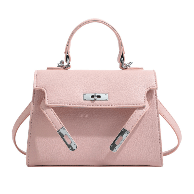 Sac à main rose en cuir texturé avec poignée supérieure, fermoir métallique argenté et bandoulière amovible. Accessoire mode élégant et tendance.