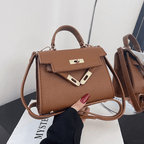 Sac à main en cuir marron avec bandoulière, design élégant et moderne, idéal pour la mode féminine. Accessoire tendance et chic.
