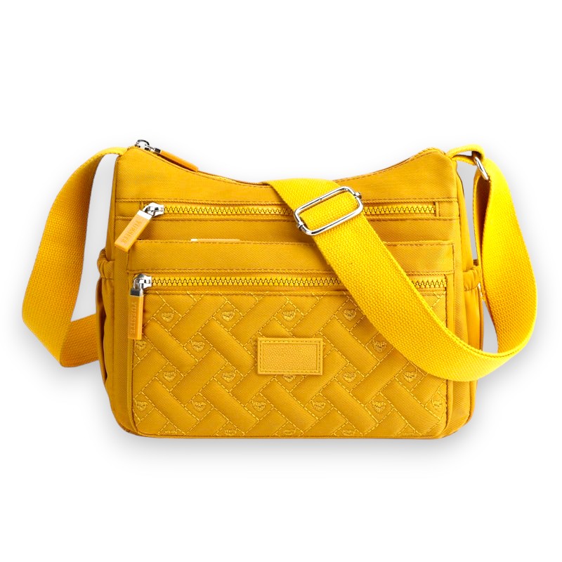 Sac à bandoulière jaune vif en tissu matelassé, avec poches zippées et sangle ajustable. Accessoire mode tendance et pratique pour femme.
