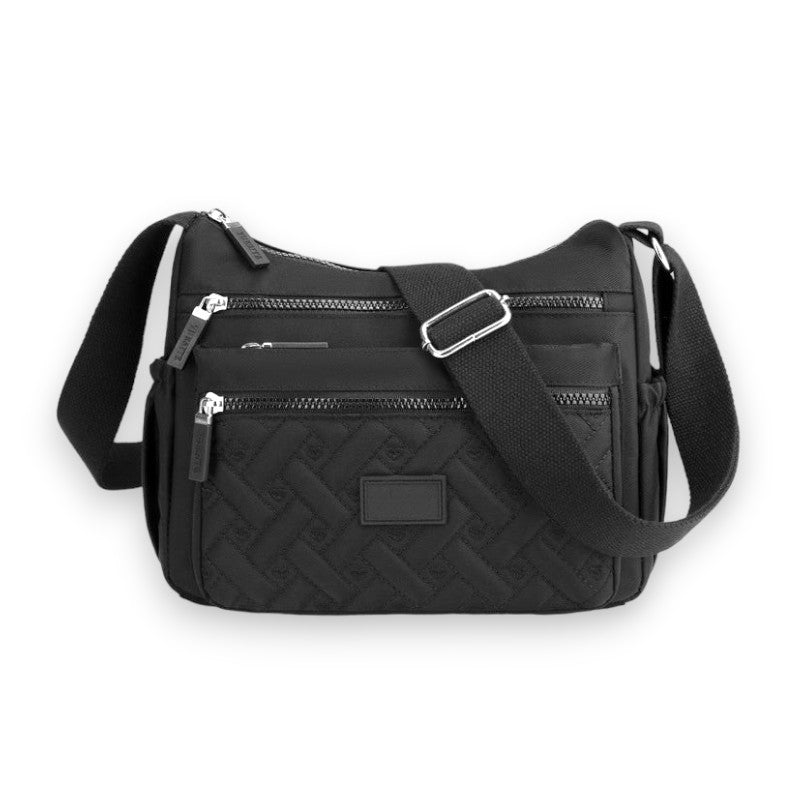 Sac à bandoulière noir en nylon avec plusieurs poches zippées, design moderne et fonctionnel, idéal pour le quotidien et les voyages.