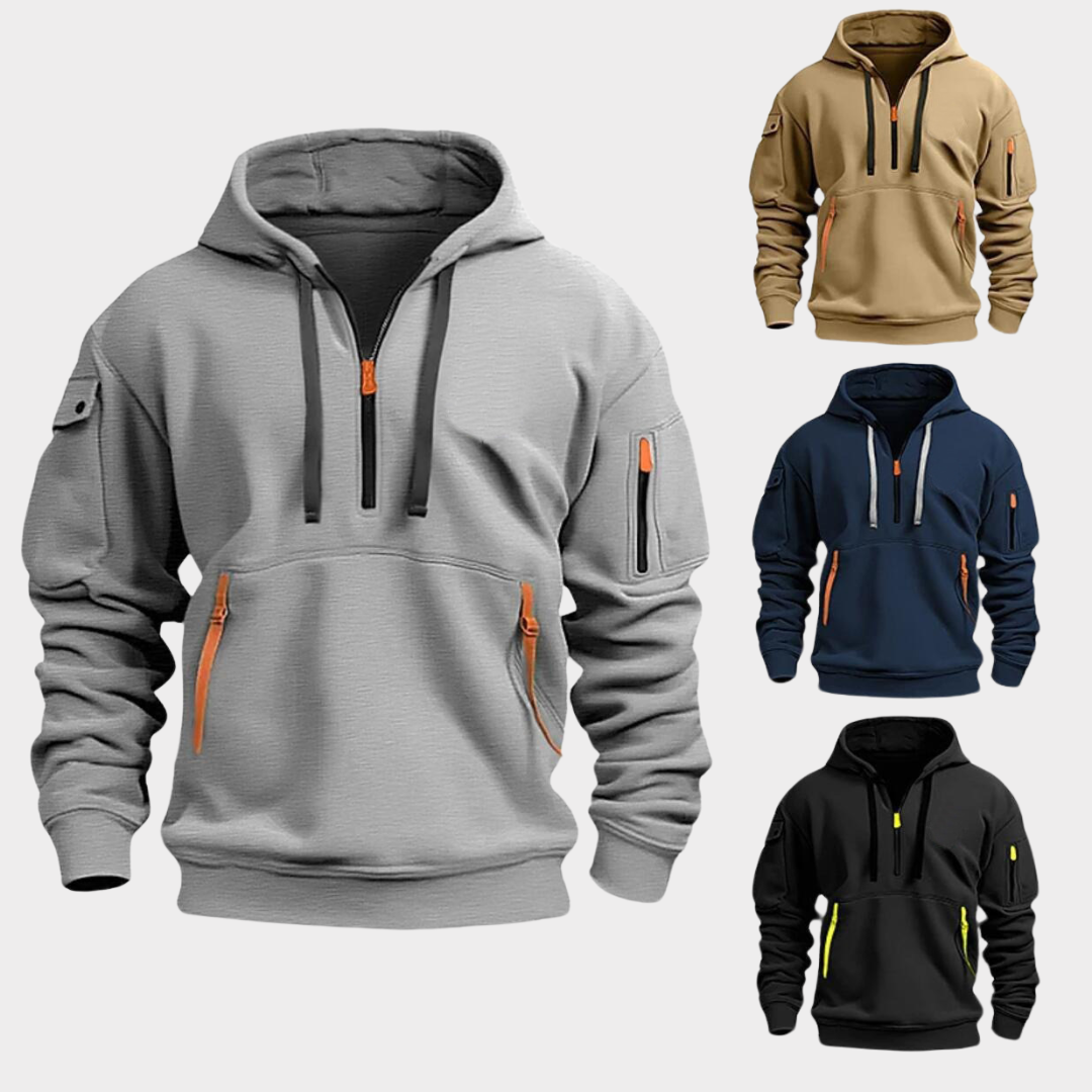 Quatre sweats à capuche tactiques pour hommes, avec poches zippées, en gris, beige, bleu marine et noir, sur fond blanc. Mode décontractée et fonctionnelle.