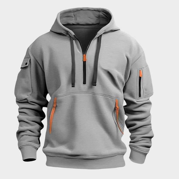 Sweat à capuche gris avec fermeture éclair orange, poches zippées et manches longues. Style décontracté, idéal pour mode urbaine et sportswear.
