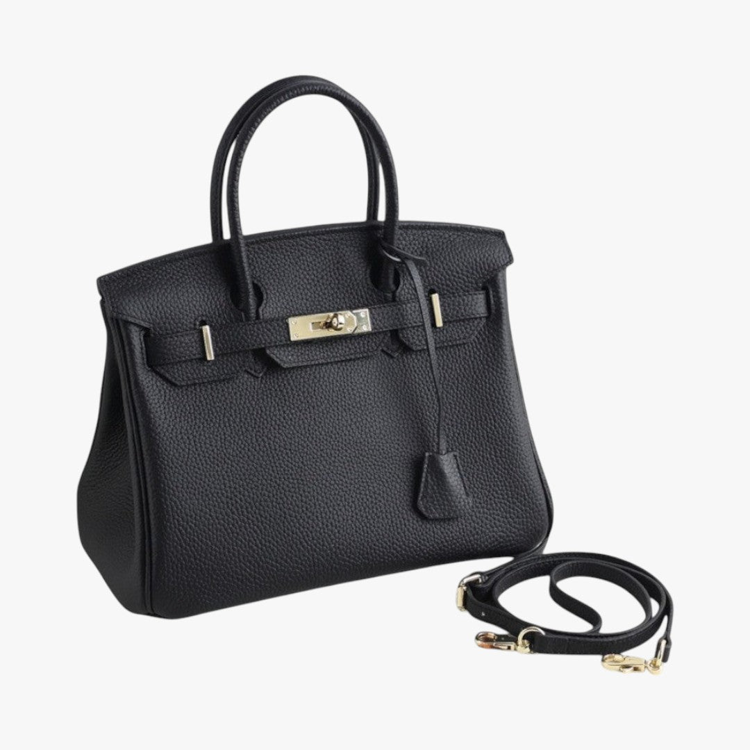 Sac à main noir en cuir texturé avec bandoulière détachable, fermoir métallique argenté, design élégant et moderne, accessoire de mode chic.