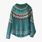 Pull en laine bleu-vert avec motif jacquard nordique, manches longues, col rond. Mode hiver, tricot chaud, style scandinave.