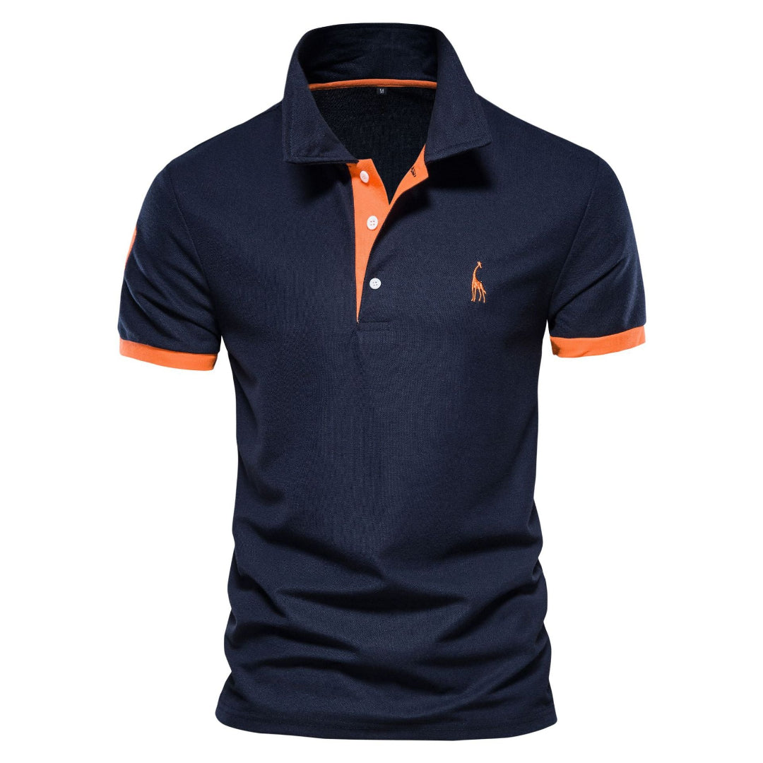 Polo bleu marine pour homme avec col et manches orange, logo brodé, style décontracté, mode masculine, vêtement tendance, haute qualité.