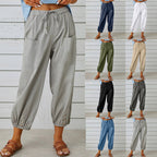 Pantalon ample femme en lin, taille élastique, poches avant, boutons bas de jambe, disponible en plusieurs couleurs: gris, bleu, blanc, noir, kaki.