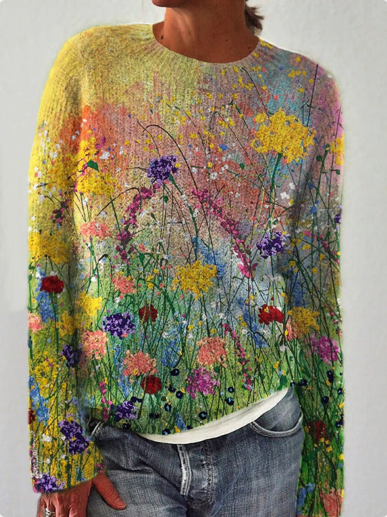 Pull en laine coloré avec motif floral vibrant, représentant un champ de fleurs multicolores. Mode tendance, style artistique, vêtements uniques.