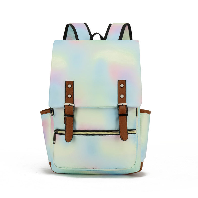 Sac à dos holographique multicolore avec bretelles ajustables, poches latérales et fermetures à boucle. Accessoire tendance pour étudiants et voyageurs.