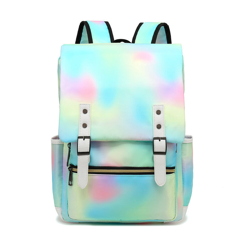 Sac à dos multicolore pastel avec bretelles réglables, poches latérales et fermeture à boucle. Idéal pour école, voyage, mode tendance.