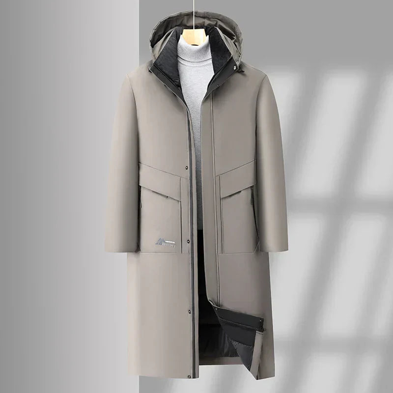 Manteau d'hiver gris pour homme avec capuche, design élégant, poches avant, fermeture éclair, idéal pour temps froid, mode masculine moderne.