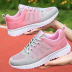 Chaussures de sport légères pour femmes, rose et gris, semelle antidérapante, idéales pour la course et le fitness, confort et style moderne.