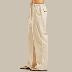 Pantalon ample beige en lin pour homme, taille élastique, poches latérales, style décontracté, idéal pour l'été et les tenues décontractées.