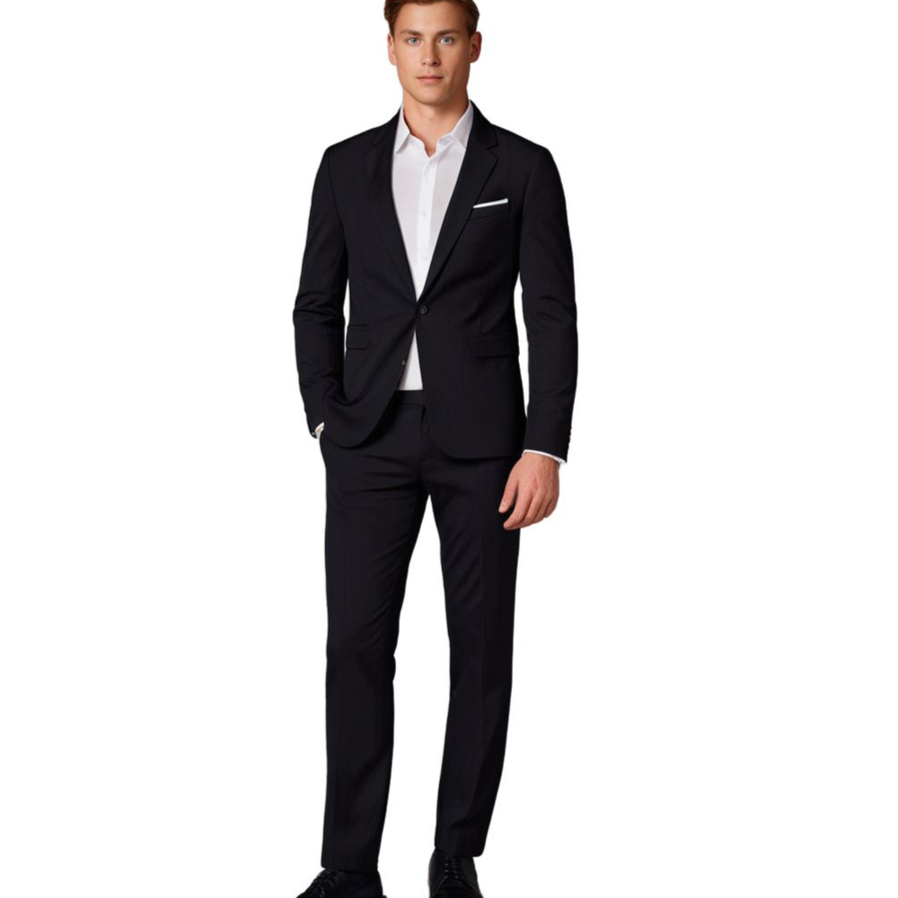 Homme en costume noir élégant, chemise blanche, posant debout. Mode masculine, tenue formelle, style professionnel, fond blanc.