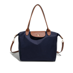 Sac à main bleu marine avec poignées et rabat en cuir marron, design élégant et pratique, idéal pour la mode féminine et le quotidien.