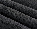 Tissu polaire noir texturé, doux et chaud, idéal pour vêtements d'hiver, couvertures et accessoires confortables.