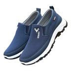 Chaussures de sport bleues pour hommes, style slip-on, semelle antidérapante, logo cerf, confortables et légères, idéales pour la marche.