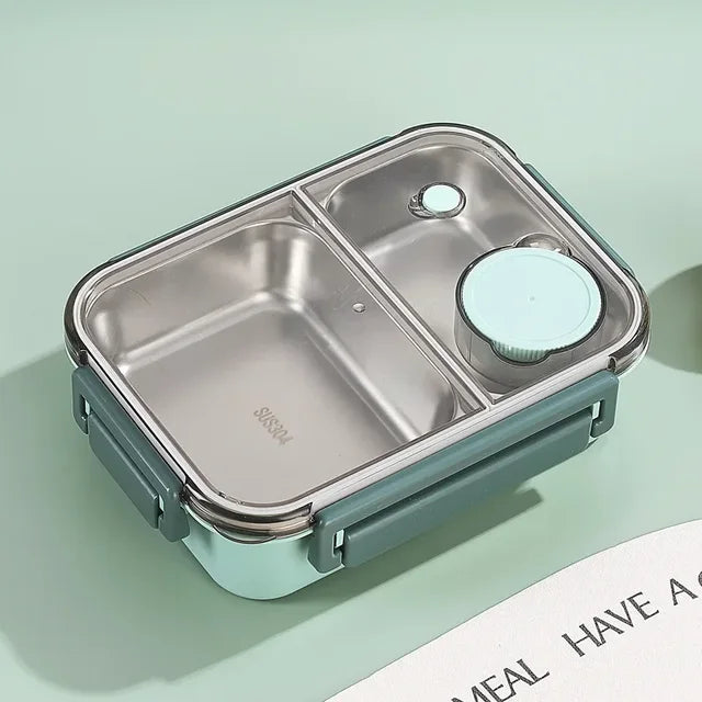 Boîte à lunch en acier inoxydable avec compartiments, couvercle hermétique et design moderne. Idéale pour repas sains et transportables.