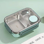 Boîte à lunch en acier inoxydable avec compartiments, couvercle hermétique et design moderne. Idéale pour repas sains et transportables.
