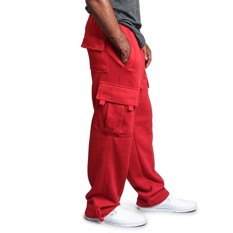 Pantalon cargo rouge pour homme, poches multiples, style décontracté, coupe ample, tissu confortable, idéal pour mode urbaine et activités extérieures.