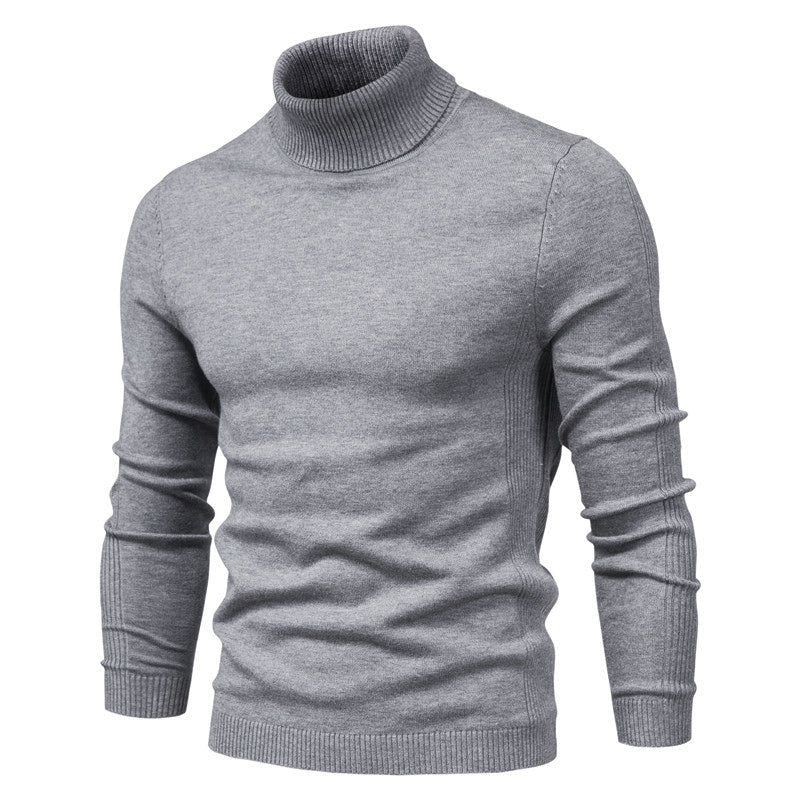 Pull-over col roulé gris pour homme, manches longues, tricoté, style élégant et moderne, idéal pour l'hiver et la mode masculine.