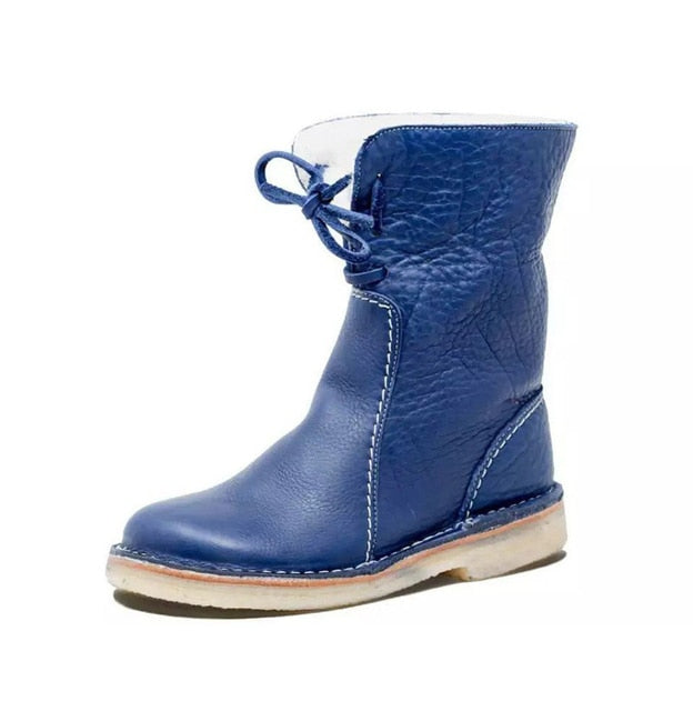 Botte en cuir bleu pour enfant avec lacets, semelle en caoutchouc beige, design moderne et confortable. Chaussure hiver tendance.