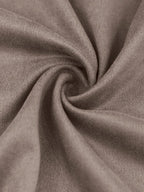 Tissu en velours beige, texture douce et luxueuse, drapé en spirale. Idéal pour décoration intérieure, mode, ameublement.