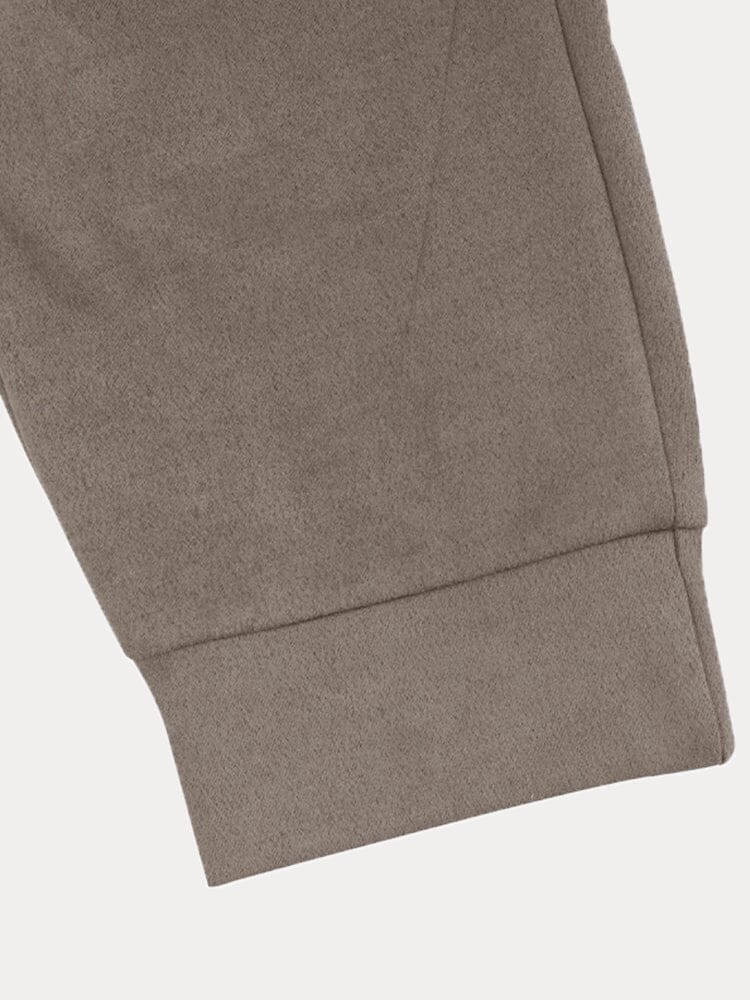 Bas de pantalon en molleton gris, coupe droite, tissu doux et confortable, idéal pour l'hiver. Mode décontractée, vêtement chaud, style moderne.