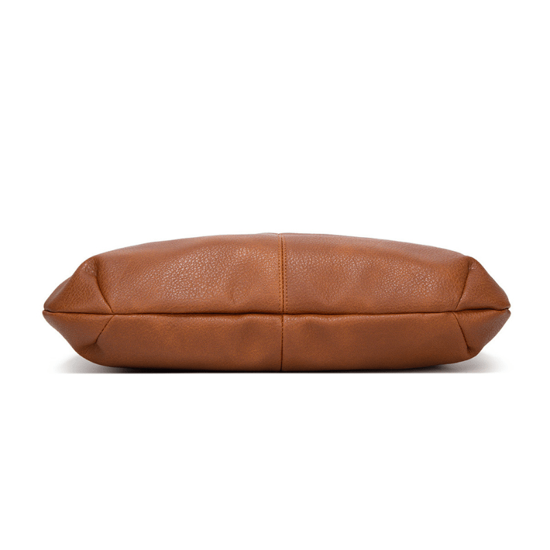 Sac à main en cuir marron, design minimaliste, vue de côté. Accessoire de mode élégant pour femmes, idéal pour un style chic et moderne.