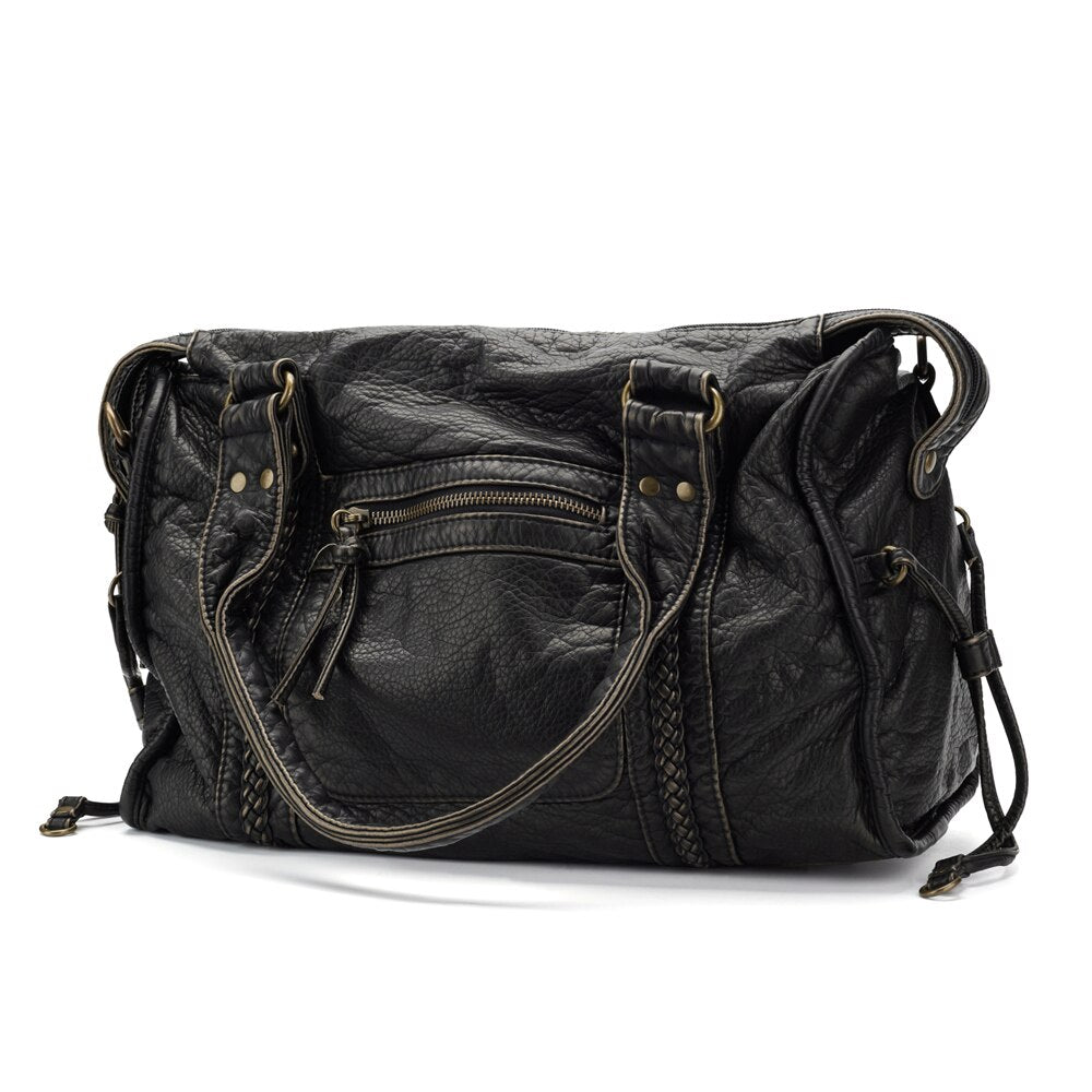 Sac à main en cuir noir avec poches zippées et anses robustes, design élégant et pratique, idéal pour la mode féminine et le quotidien.