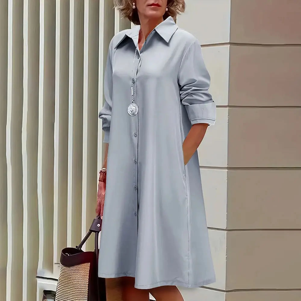 Vestido camisero de corte A para mujer, abotonado, manga larga, cuello clásico y largo hasta la rodilla.