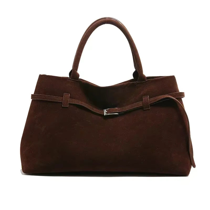Sac à main en cuir marron foncé, élégant et spacieux, avec poignées doubles et fermeture métallique. Accessoire mode femme chic et tendance.