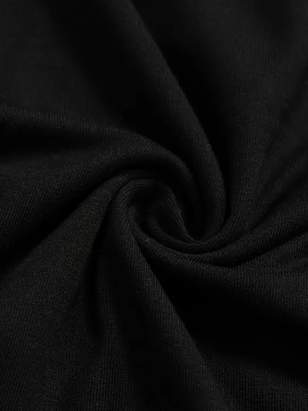 Tissu noir en coton, texture douce et torsadée, idéal pour vêtements et couture. Matériau de haute qualité, résistant et polyvalent.