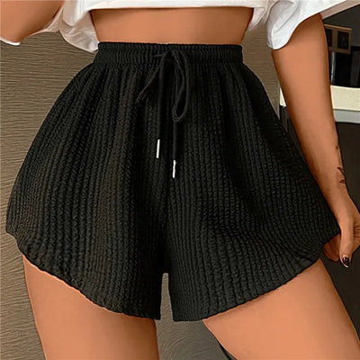Noor - Shorts anchos con cordón