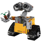 Robot LEGO WALL-E jaune avec bras articulés, yeux expressifs et plante verte. Jouet de construction populaire, inspiré du film d'animation Pixar.