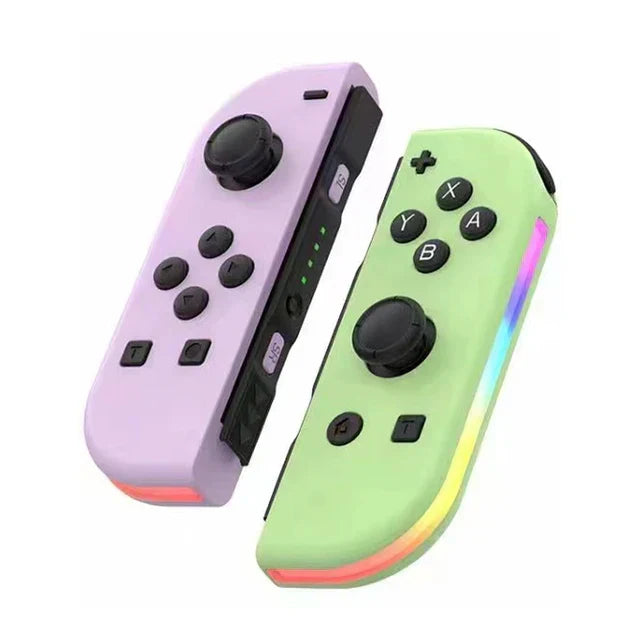 Manettes de jeu Joy-Con pastel, violet et vert, avec boutons et sticks analogiques, compatibles Nintendo Switch, sur fond blanc.