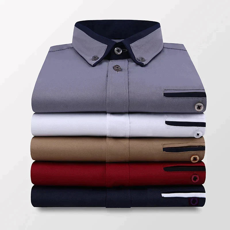 Chemises homme élégantes pliées, couleurs variées : gris, blanc, beige, rouge, bleu marine. Mode masculine, vêtements formels, style classique.